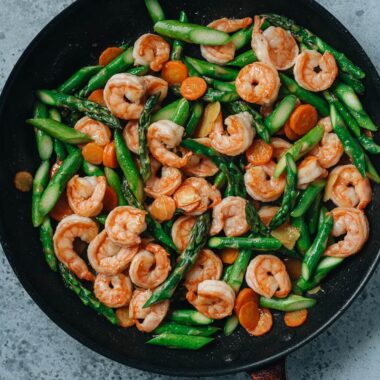 Shrimp and asparagus stir fry in a pan