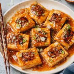 Chinese stuffed tofu is tender with a juicy pork filling, cooked in a fragrant brown sauce. It pairs beautifully with rice to make a delicious and nutritious meal. {Gluten-Free Adaptable}